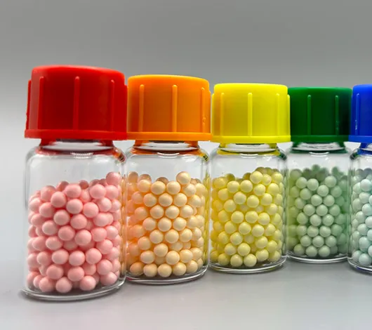 LyoBeads_Blog_Thumb_0625 Rainbow-colored vials of lyophilzed beads (lyo beads), with NEB logo