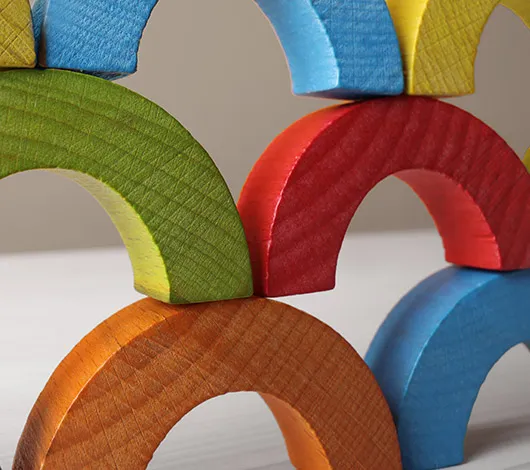 Stack of colorful wooden arch blocks