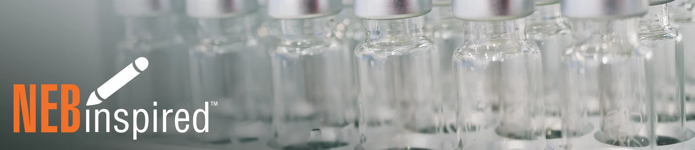 Rows of glass vaccine vials, with NEBinspired logo