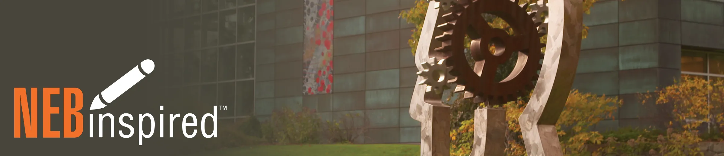 Head sculpture at NEB Ipswich campus, with NEBinspired logo