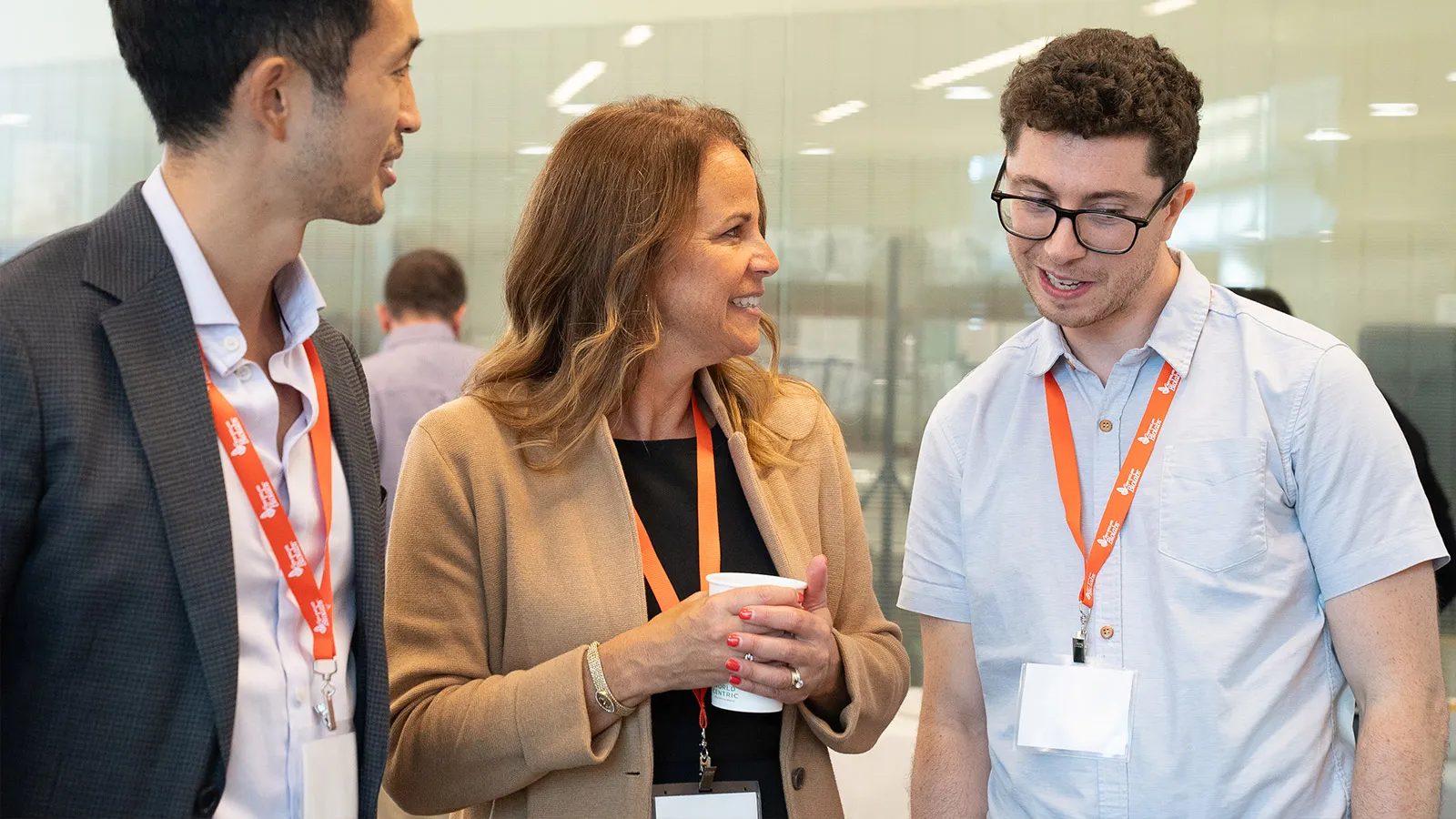 Jim Chadwick talking with two spectators at a poster session