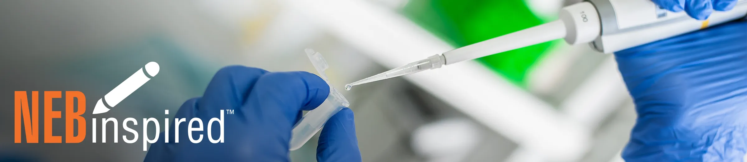 Closeup of gloved hand pipetting into tube, with NEBinspired logo